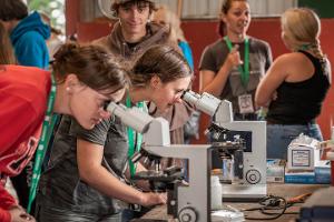 two girls at microscopes