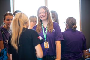 girl smiling talking to another girl