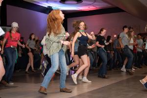 group dancing with two girls in front