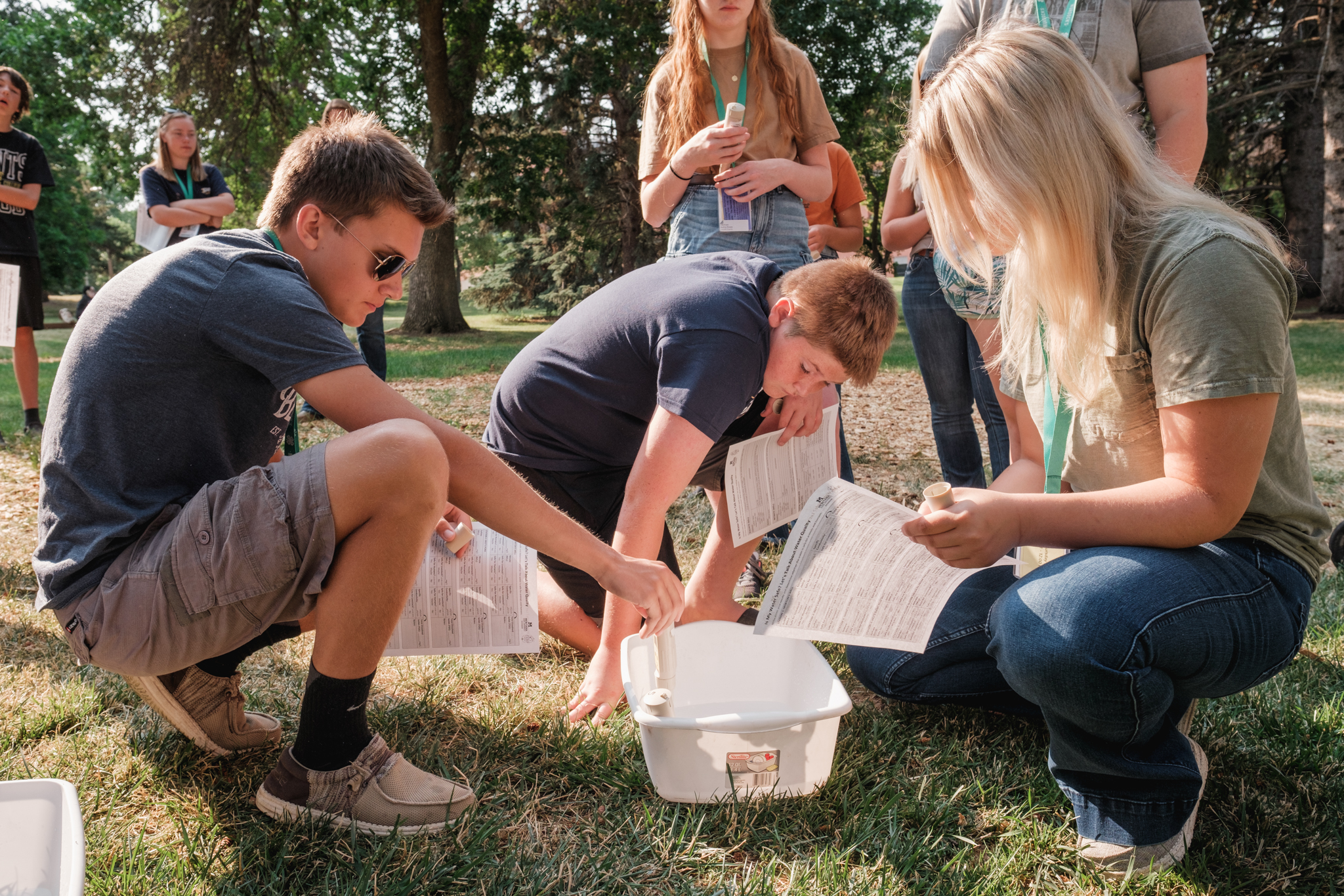 Teens complete a science experiment