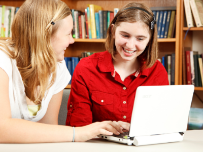 two girls at a computer