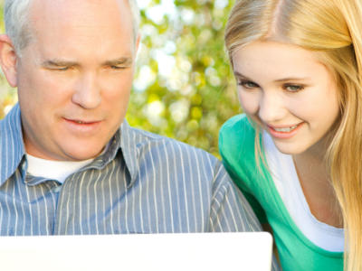 man and girl at computer