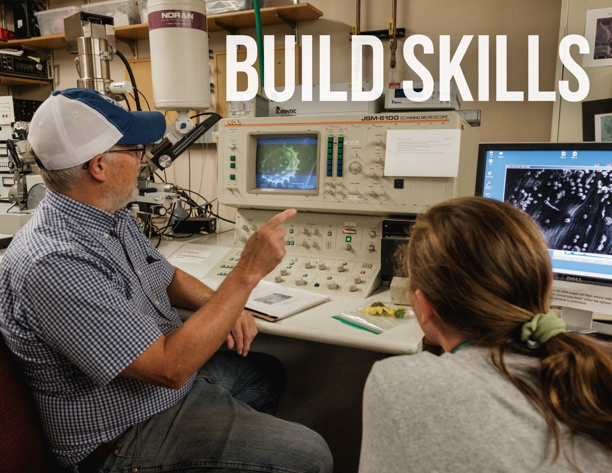 Build Skills: A male technician shows a female club member an ultrasound