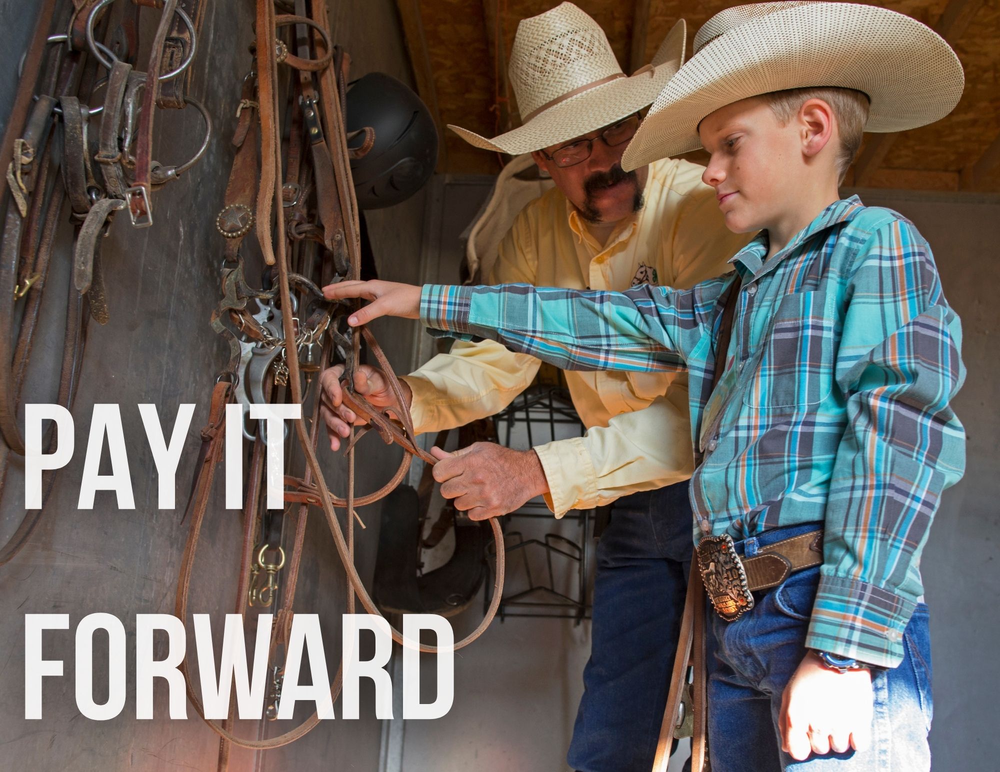 A male volunteer helps a boy with horse tack. Text: Pay it Forward 