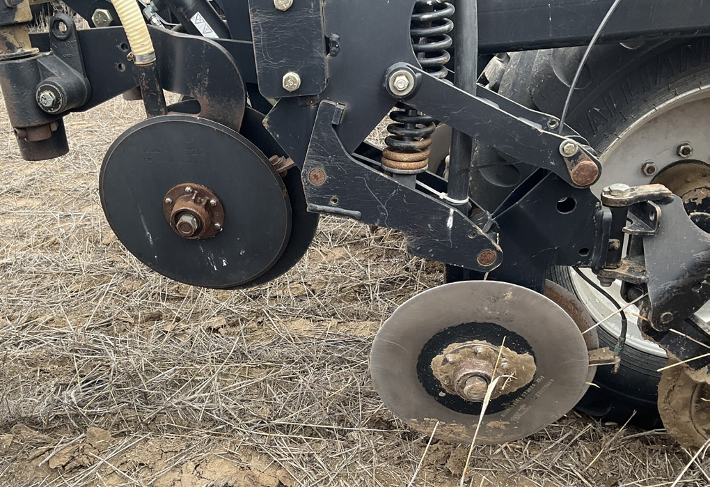 Double-disc drill for seeding into high residue no-till managed fields.