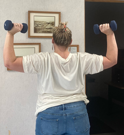 Woman holding weights in the air