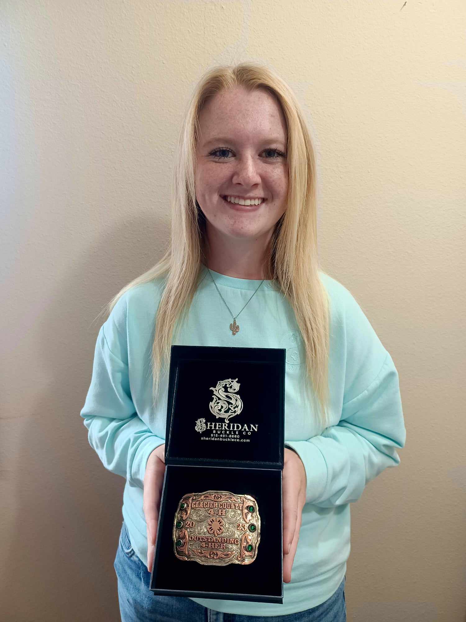 Addisyn Bengtson was named the Glacier County 4-H Outstanding Member for 22 – 23, receiving a custom belt buckle and having her name engraved on a plaque in the Extension Office.  