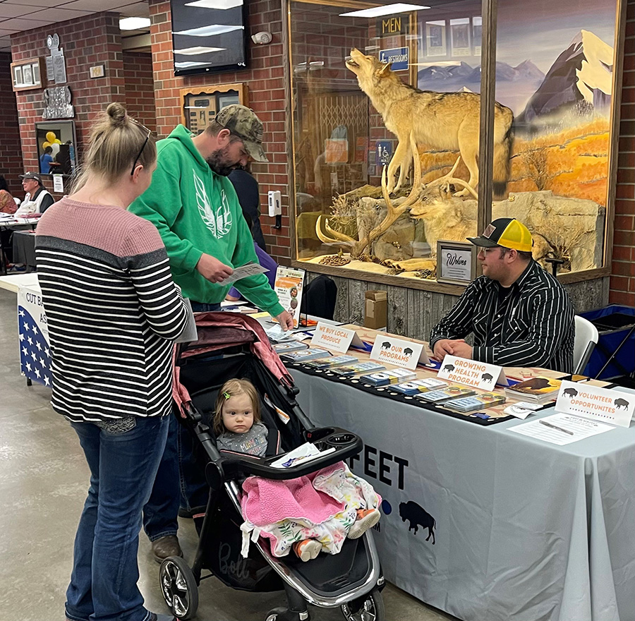 New residents, Chris and Alissa Hapka and daughter Hannah, enjoyed seeing what all the community offers at the Community Connection Expo, including visiting with FAST Blackfeet.