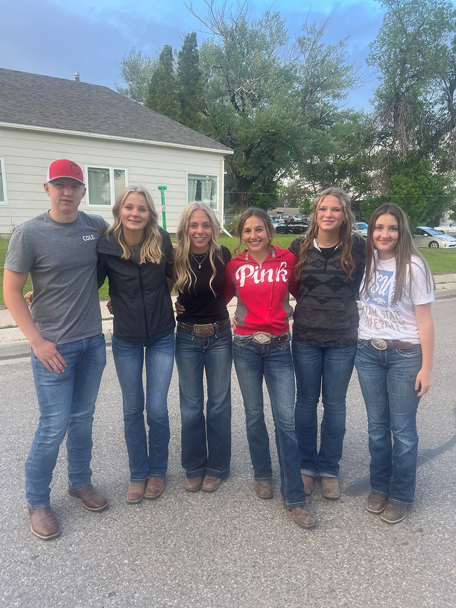 Pondera 4-H Ambassadors take a photo break from setting up the street dance after Whoop Up Trail Days.