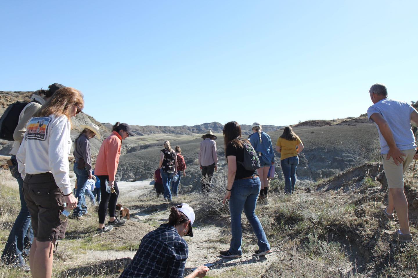 Montana Agritourism Fellows walk on a hillside