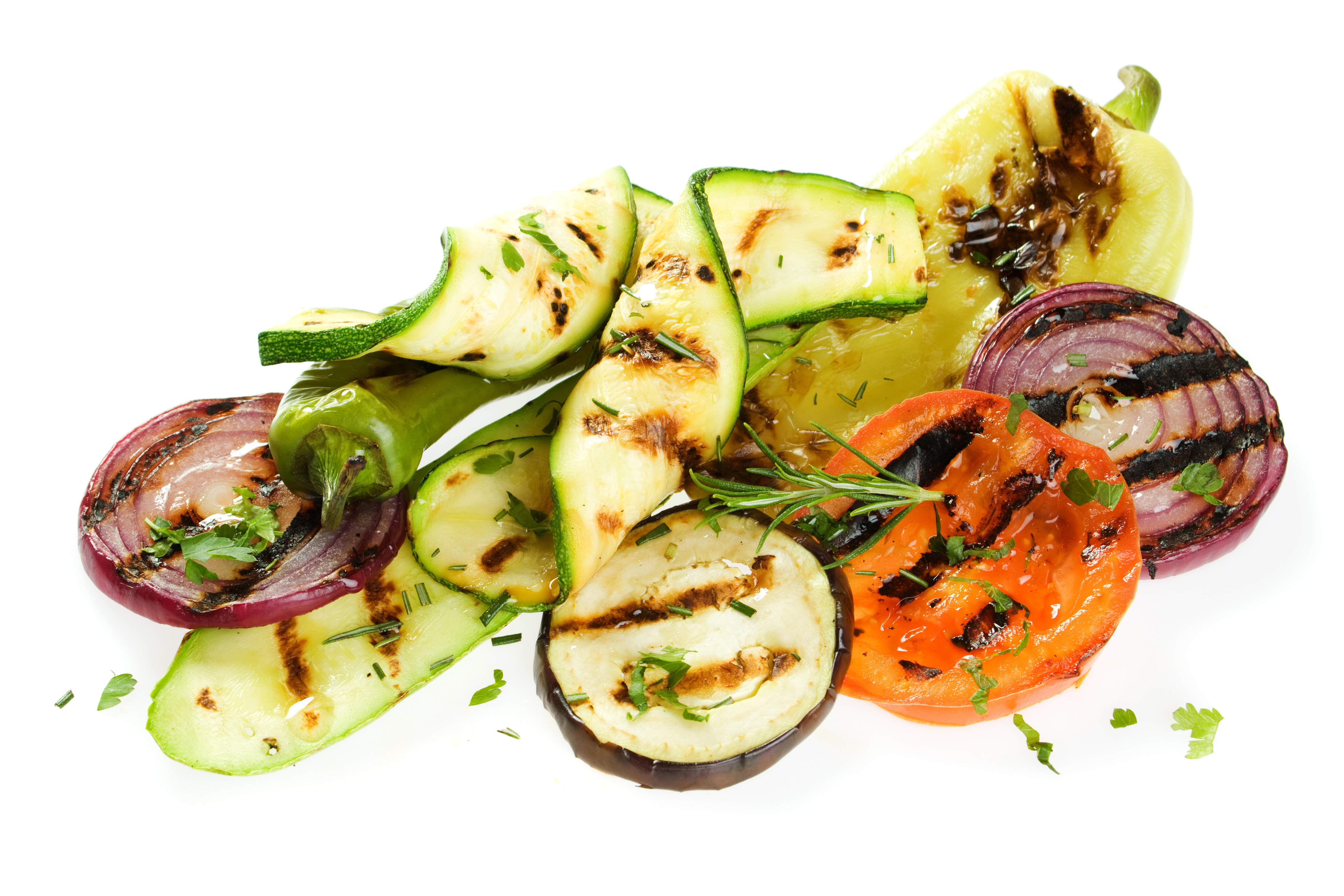 A pile of sliced vegetables such as zucchini, onions, eggplant, and tomato, all with grill marks.