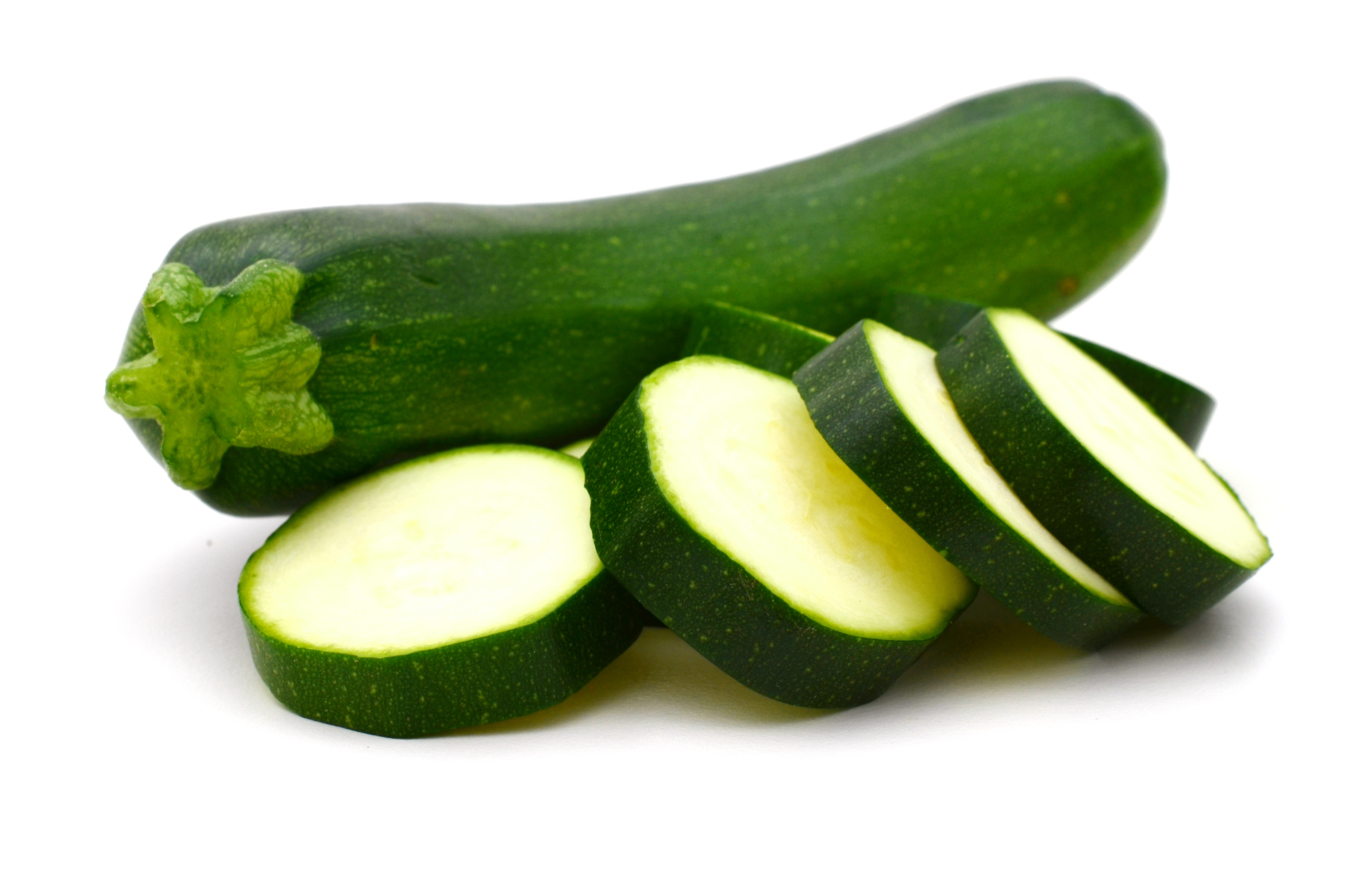 A whole green zucchini and zucchini slices.