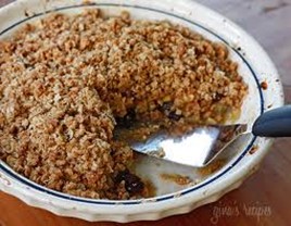 Apple, peach, or cherry crisp in a round baking dish.