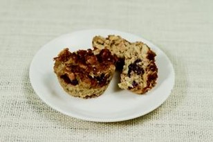 Two oatmeal muffins on a plate.