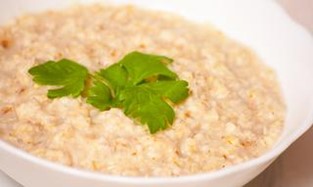 A bowl of cooked oatmeal.
