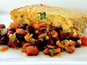 An image of Tamale Pie consisting of beans, tomatoes, and cornbread.