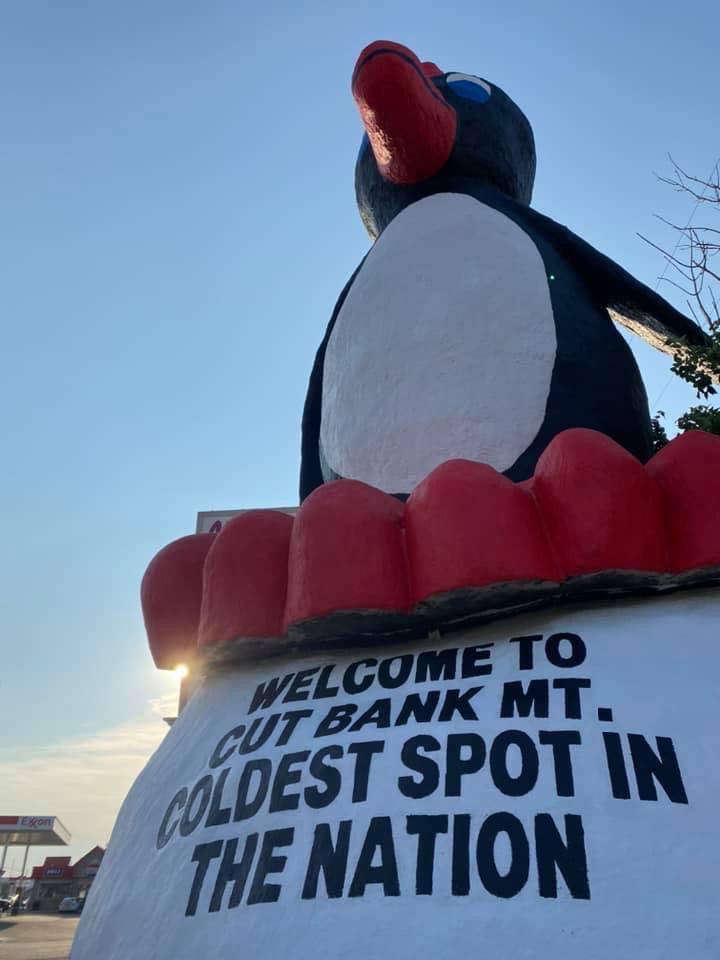 Famous Cut Bank penguin statue. "Coldest spot in the nation" slogan.