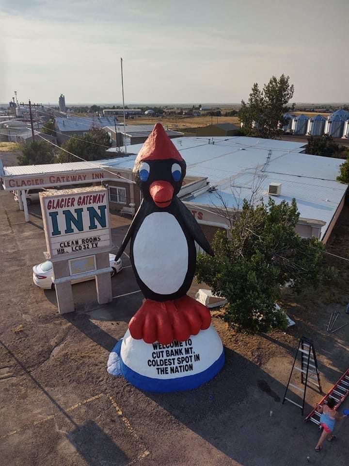 Famous Cut Bank penguin statue. "Coldest spot in the nation" slogan.