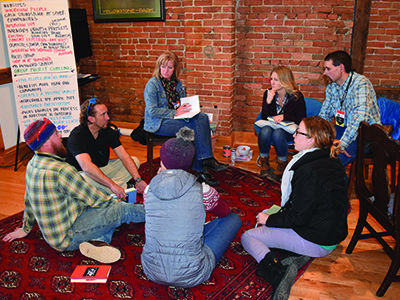 Group of people discussing leadership strategies.