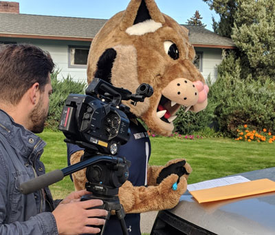 Photo of Champ the MSU mascot on an outdoor video set