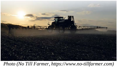 Photo, tractor spraying a field, caption: No Till Farmer, no-tillfarmer.com