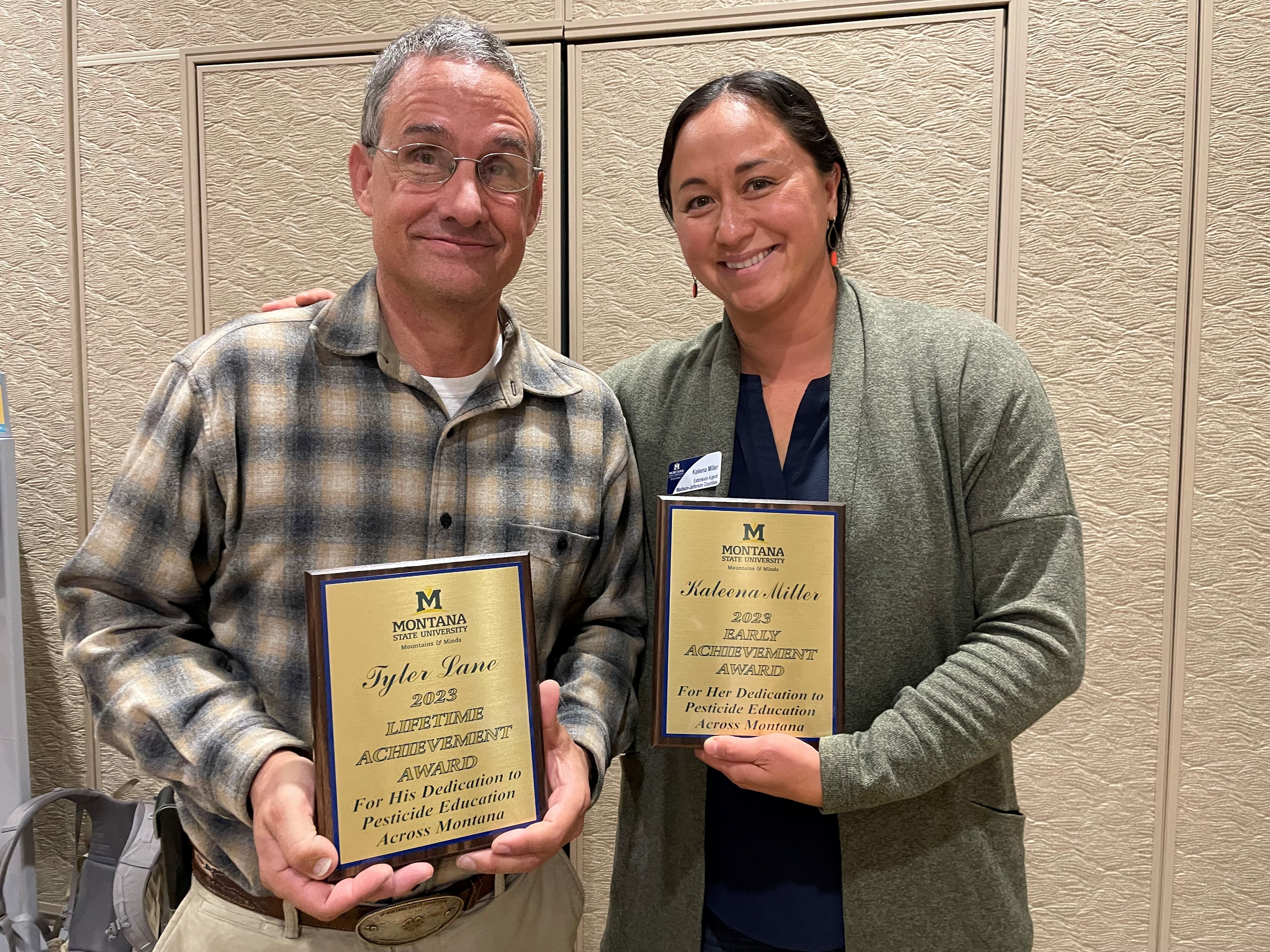 MSU Extension agents accepting pesticide education awards.