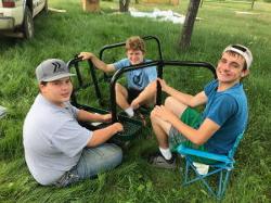 3 kids putting picnic table together