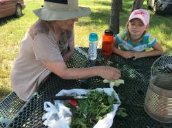 2 people eating garden produce