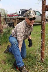 Volunteer building fence