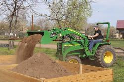 Lyman Amsden dumping dirt