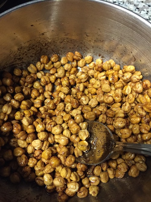 Chickpeas in bowl with oil mix