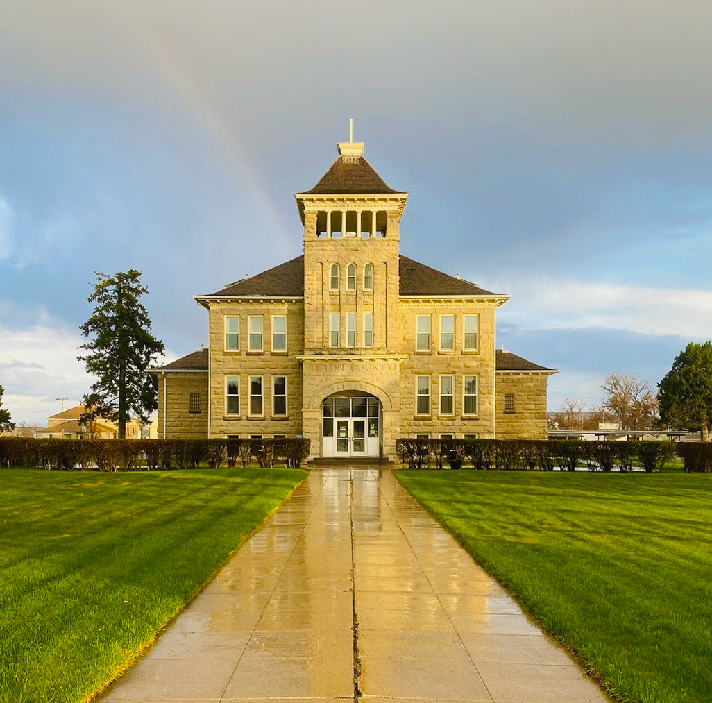 Teton County Courthouse with a rainbow after a spring storm