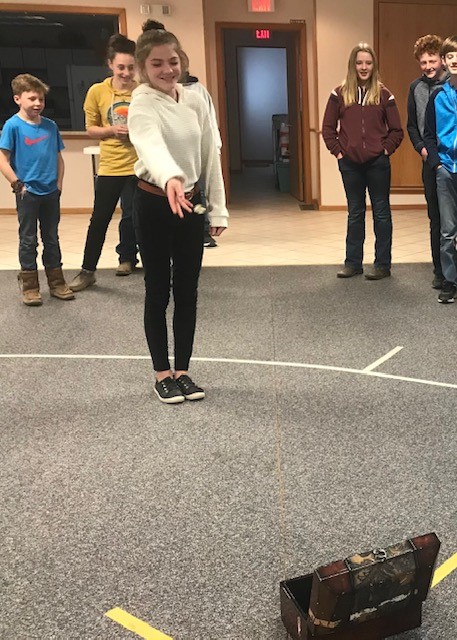 Spring Creek 4-H members play a game of toss after their March meeting.