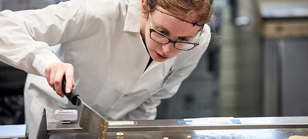 Graduate student preparing a pancake sample for a sensory test