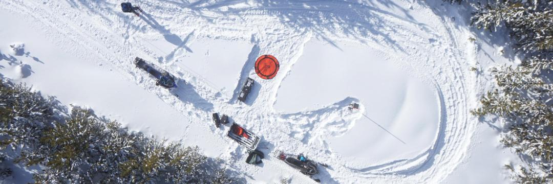 Drone flies over mapping site of the GCF in a snowy valley