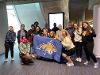 A group of our traveling Hilleman Scholars pose after making it through customs in Paris.