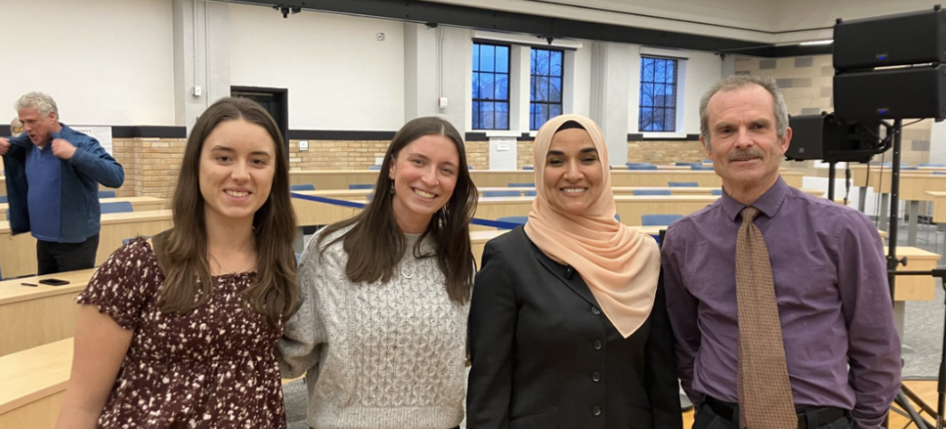 Students pose with speaker Dalia Mogahed and Honors faculty Don Demetriades 