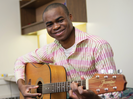 Chinomso with his guitar
