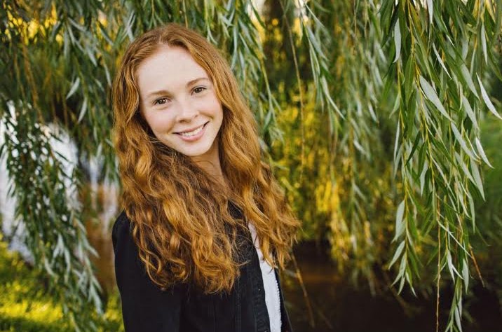 a person in front of a green background