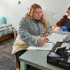 Student sits at a desk studying in a Johnstone single room 