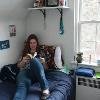 quad resident on bed reading a book