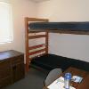 ResLife Apartment double room with bunk beds and two desl