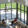 Students studying and hanging out in a common lounge area.