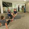 Students studying and hanging out in a common lounge area.