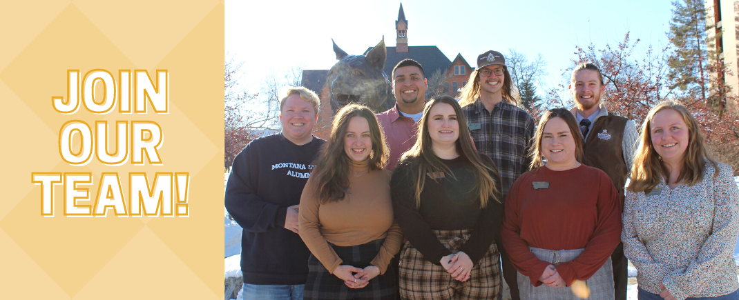 Picture of 9 community directors outside of Montana Hall and the Spirit statue with left side banner that states "Join Our Team!".