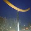The flashlight illuminates Montana State's Noodle sculpture