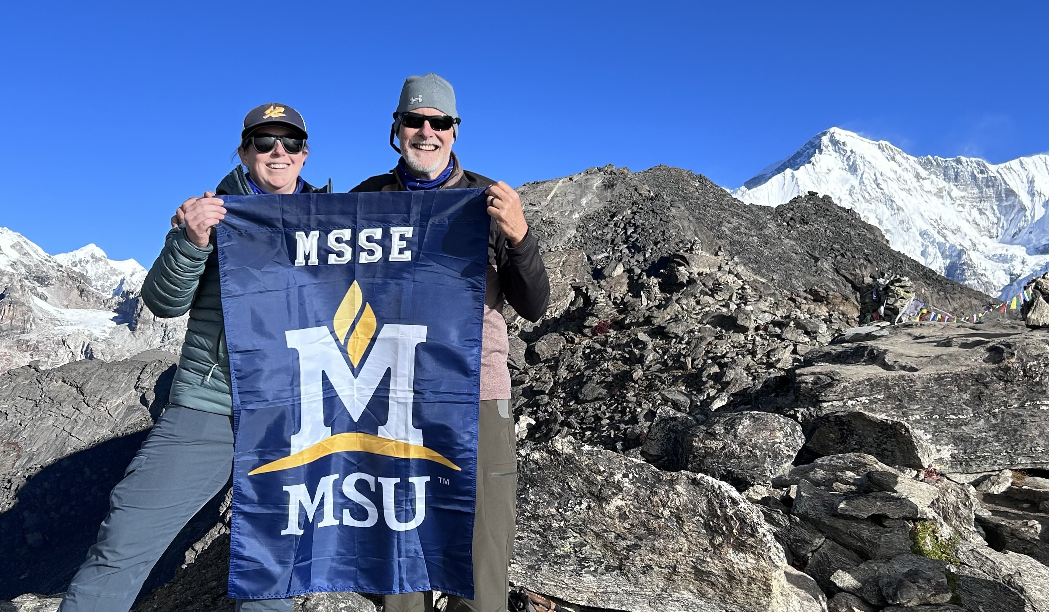 John Graves in Nepal with a student on a mountain, as part of MSSE program.