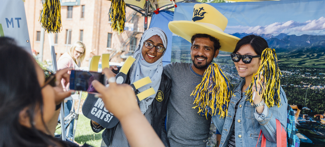 Orientation students take photos with props at "Catapalooza"