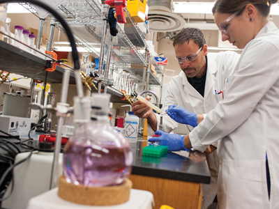Two researchers doing tests in a lab.