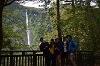 Madison and friends taking a group photo in front of a waterfall